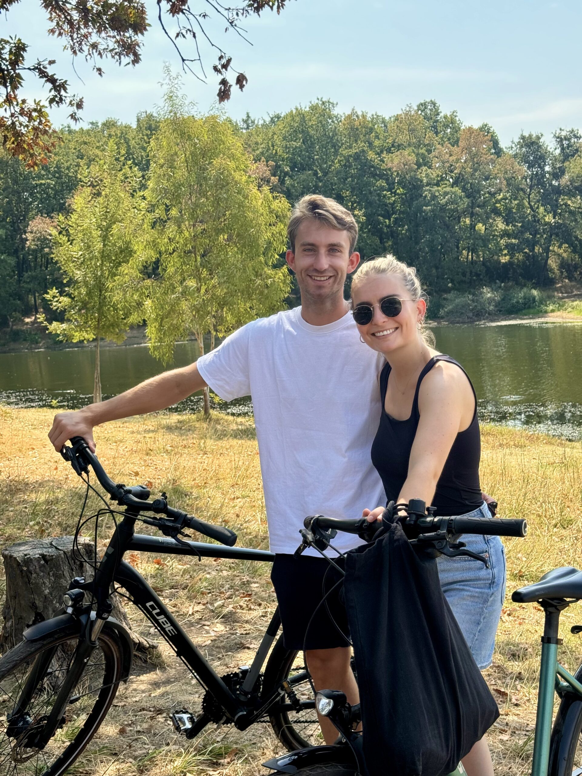 happy couple exploring tirana on a bike tour