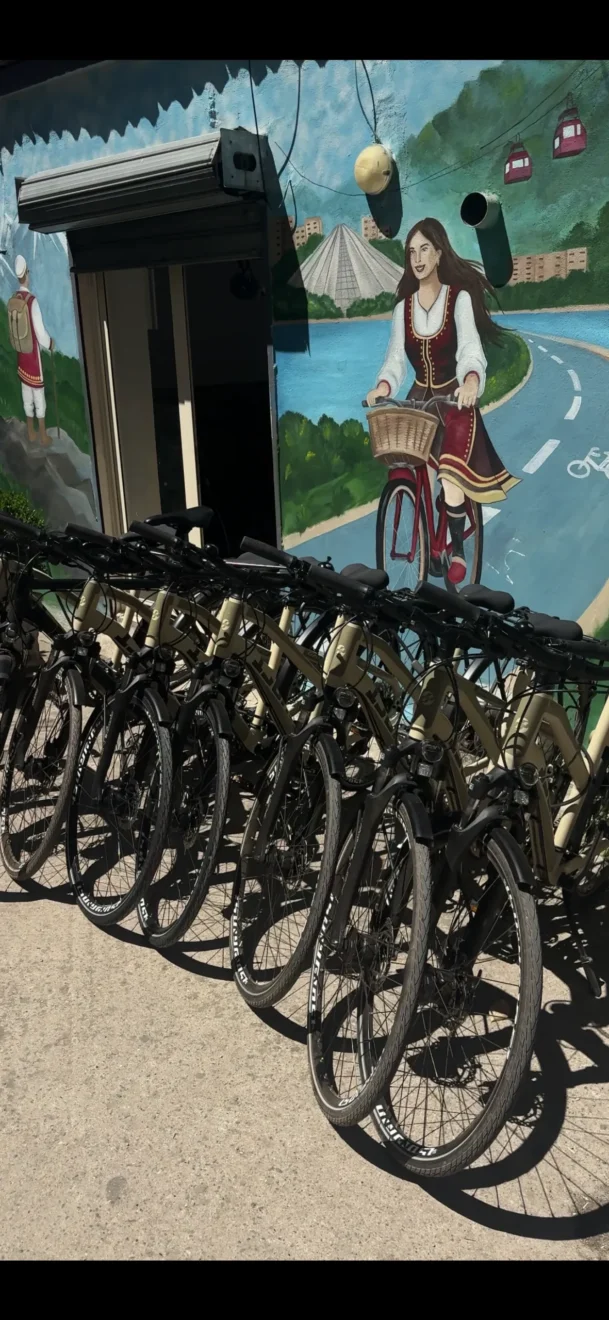 mural of the bike store of purealb and new bikes outside of the bike shop bike tirana