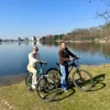 2 ladies cycling in the grand park of tirana