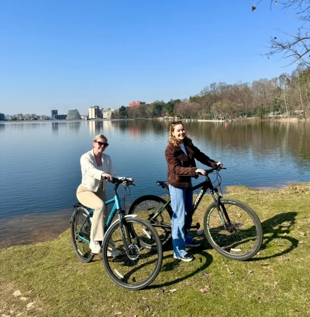 2 ladies cycling in the grand park of tirana
